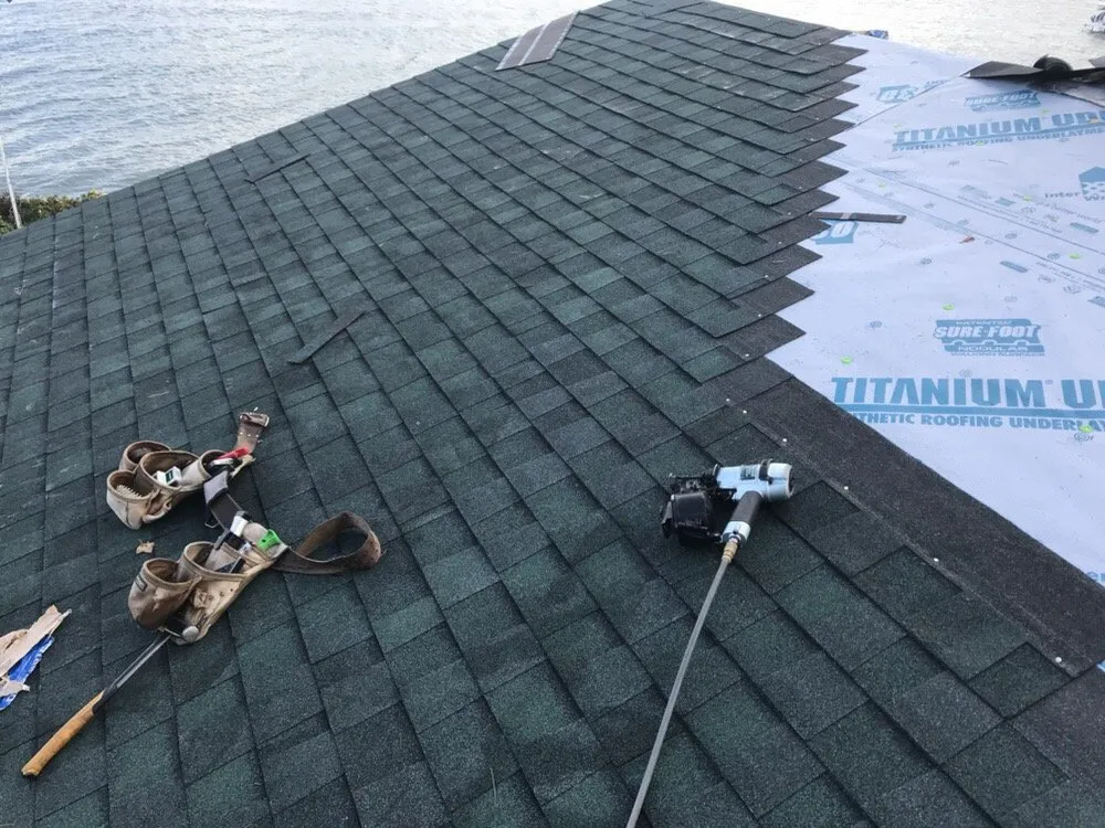 Emergency roof repair in Williamsburg, MI by Up North Exteriors