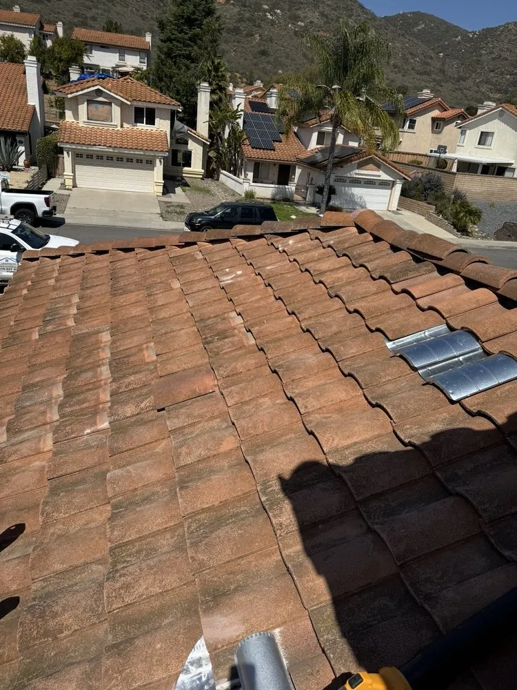 Slide of V J Roofing