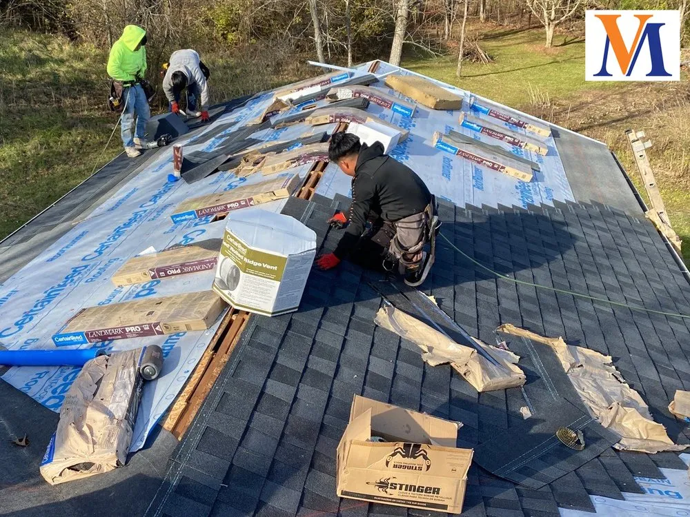 Slide of Van Martin Roofing - Mason