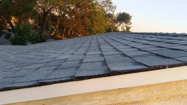 Van Zandt Roofing and Skylights Logo