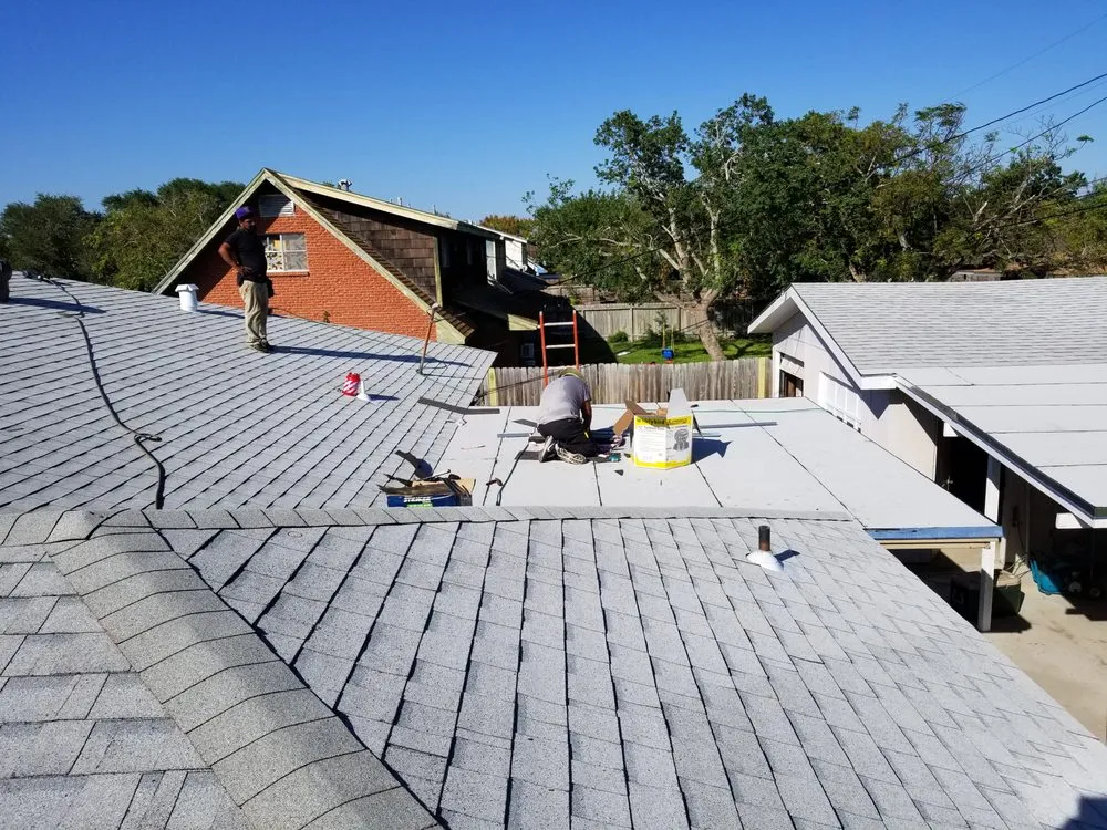 Slide of Vela's Roofing and Construction