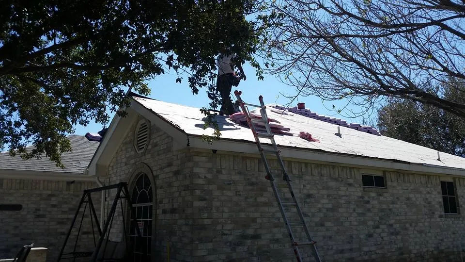 Slide of Vela's Roofing and Construction