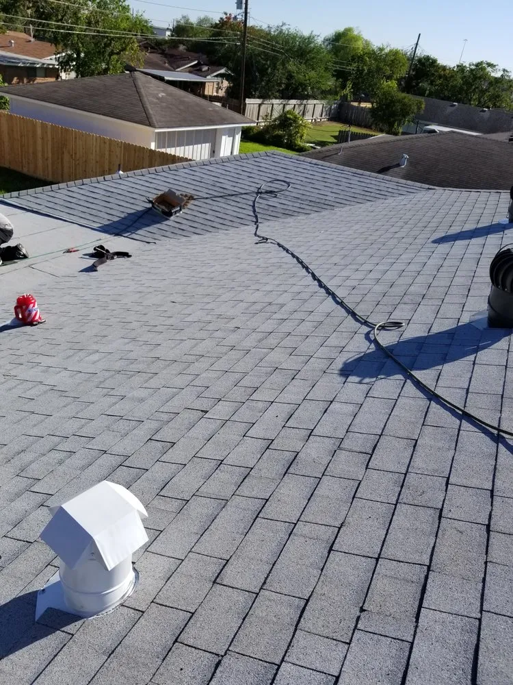 Slide of Vela's Roofing and Construction