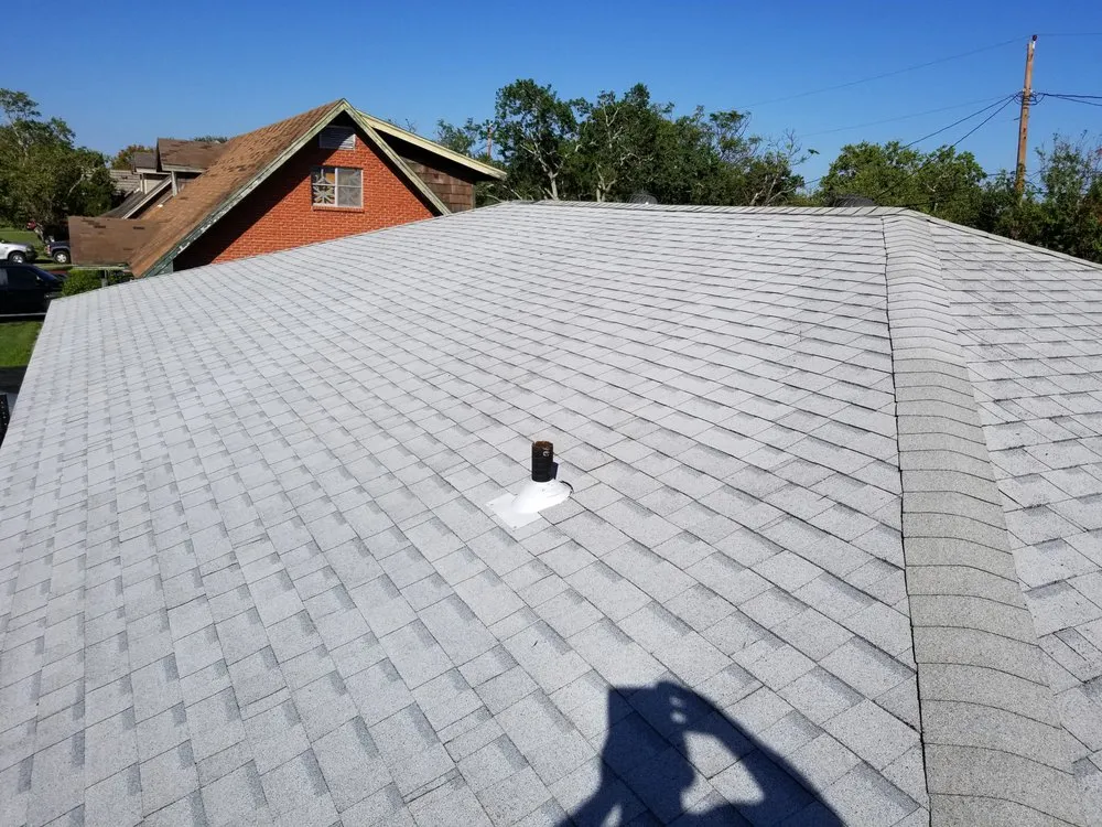 Slide of Vela's Roofing and Construction