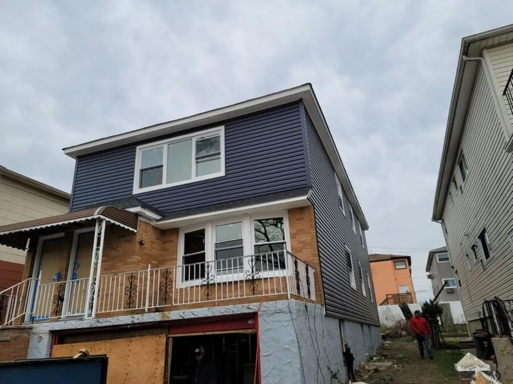 Slide of VT Seamless Gutter and Siding