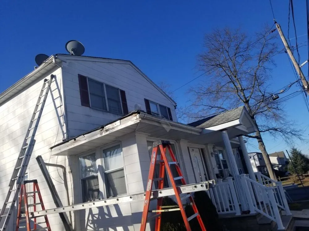 Slide of VT Seamless Gutter and Siding