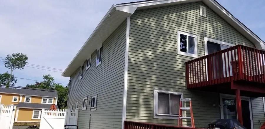 Slide of VT Seamless Gutter and Siding