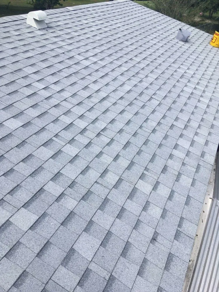 Slide of Waylon's Watertight Roofing