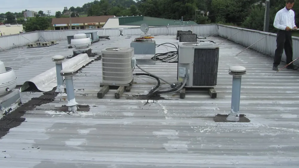 Licensed storm damage roof repair in Bennington, IN by Web Roof Coatings