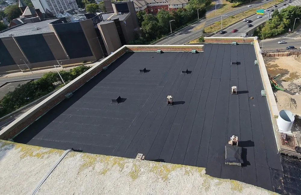 Slide of Westbury Roofing Pros