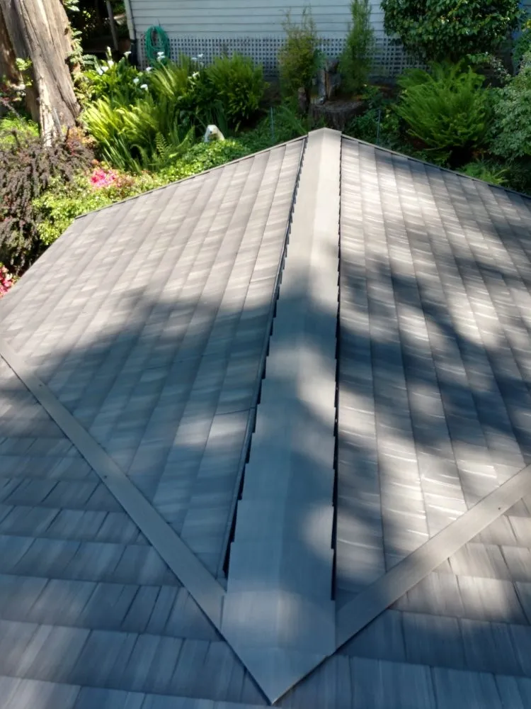 Slide of Whitman's Roofing