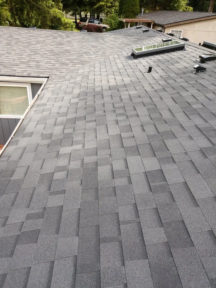 Slide of Whitman's Roofing