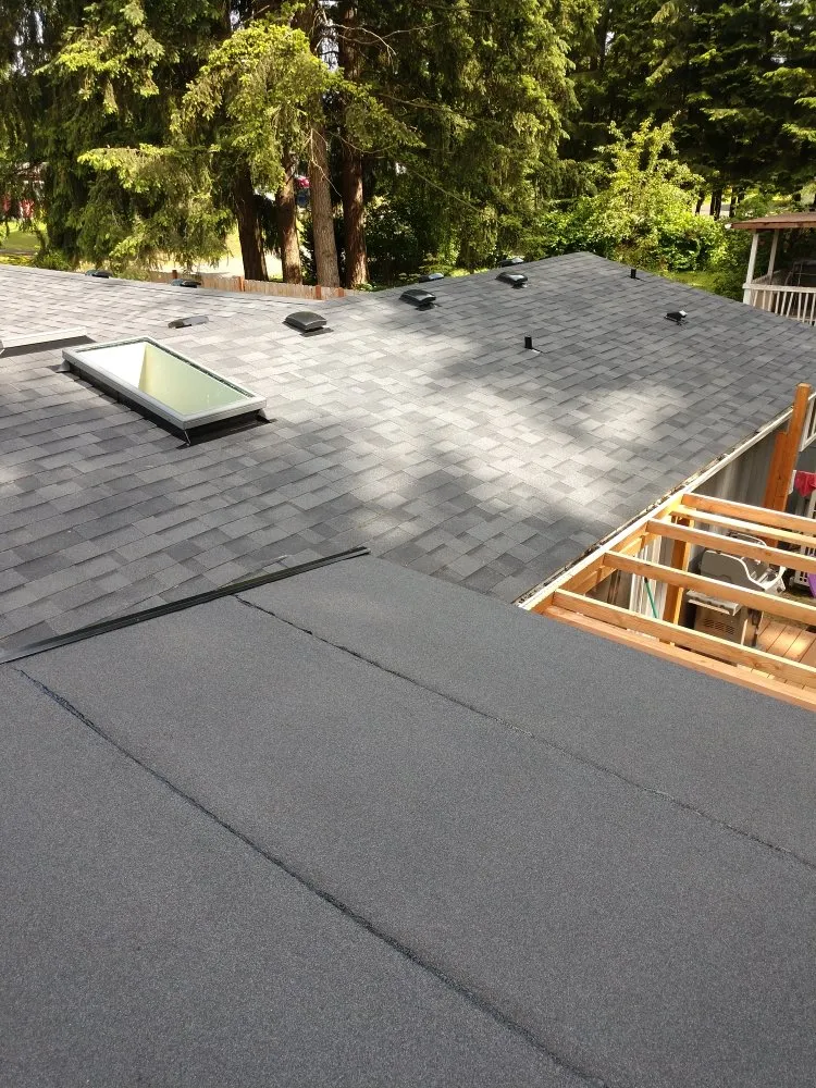 Slide of Whitman's Roofing