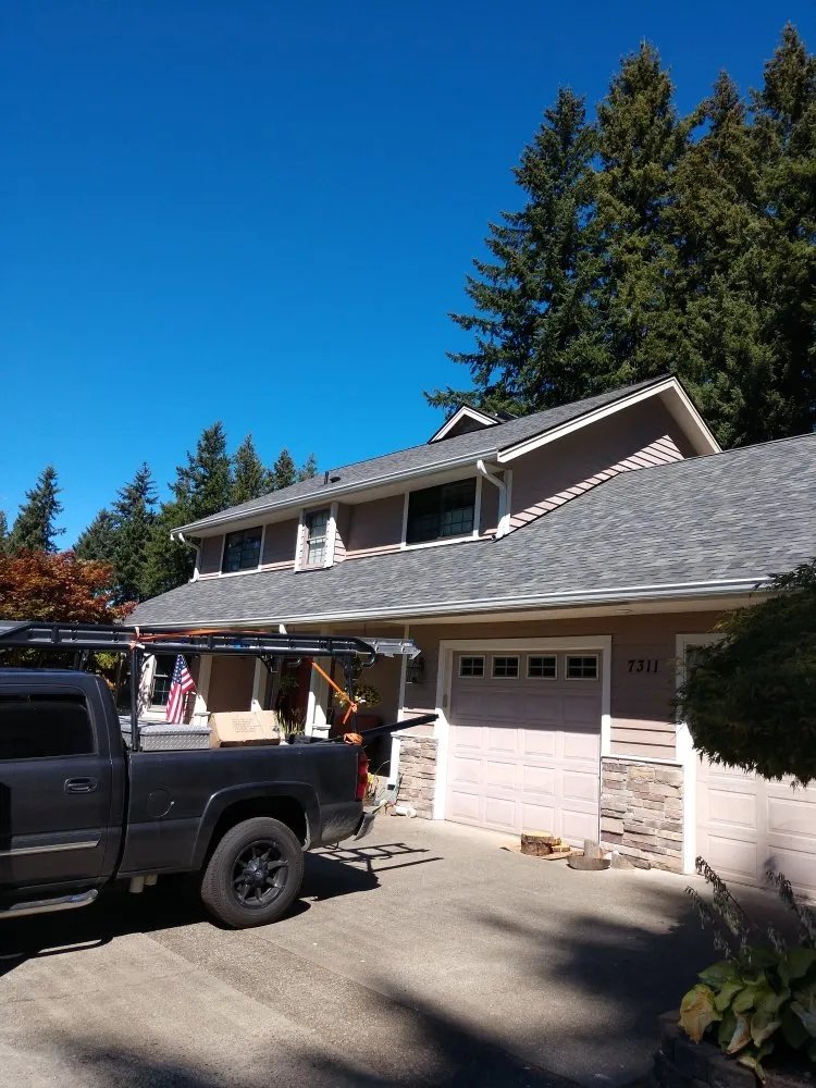 Slide of Whitman's Roofing