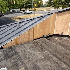 Slide of Whitman's Roofing