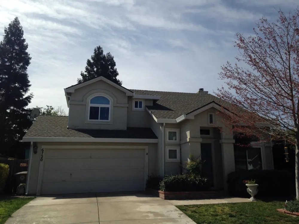 Slide of Whittaker Roofing