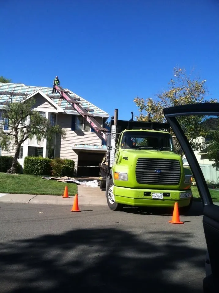 Slide of Whittaker Roofing