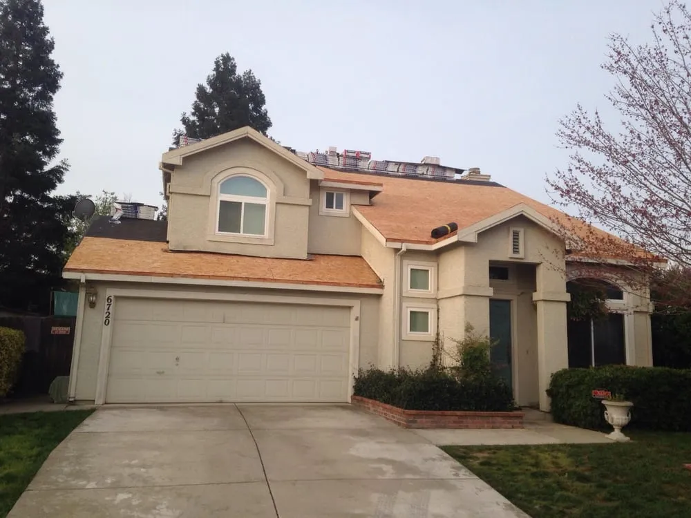 Slide of Whittaker Roofing