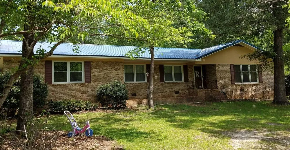 Slide of Whitt's Quality Roofing