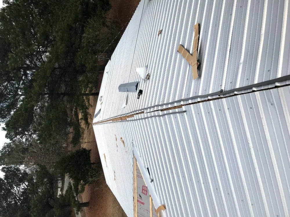 Professional storm damage roof repair same-day service in Hickory Flat, MS by Wiggins Handyman & Restoration Service