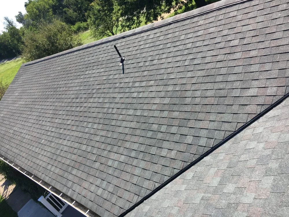Emergency storm damage roof repair in West Harrison, IN by Wilhelm Roofing
