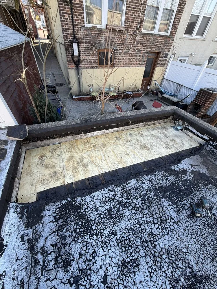 Local storm damage roof repair in Sunnyside, NY by William & Hugh Roofing