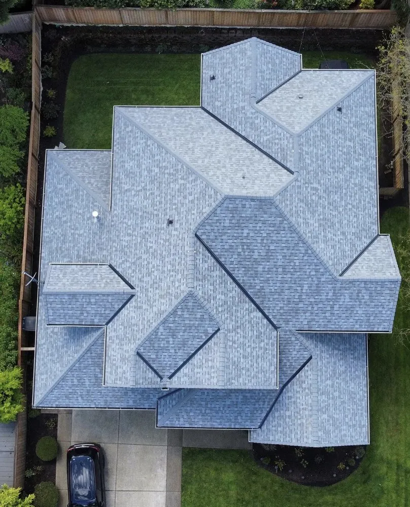 Slide of Woodpecker Roofing & Remodel