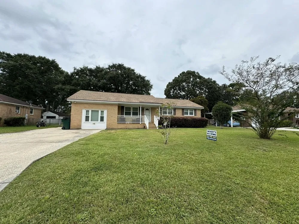 Slide of Woody's Roofing