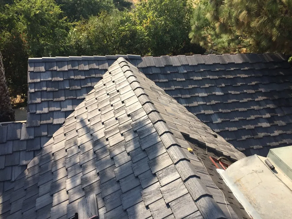 Slide of Woolf Roofing