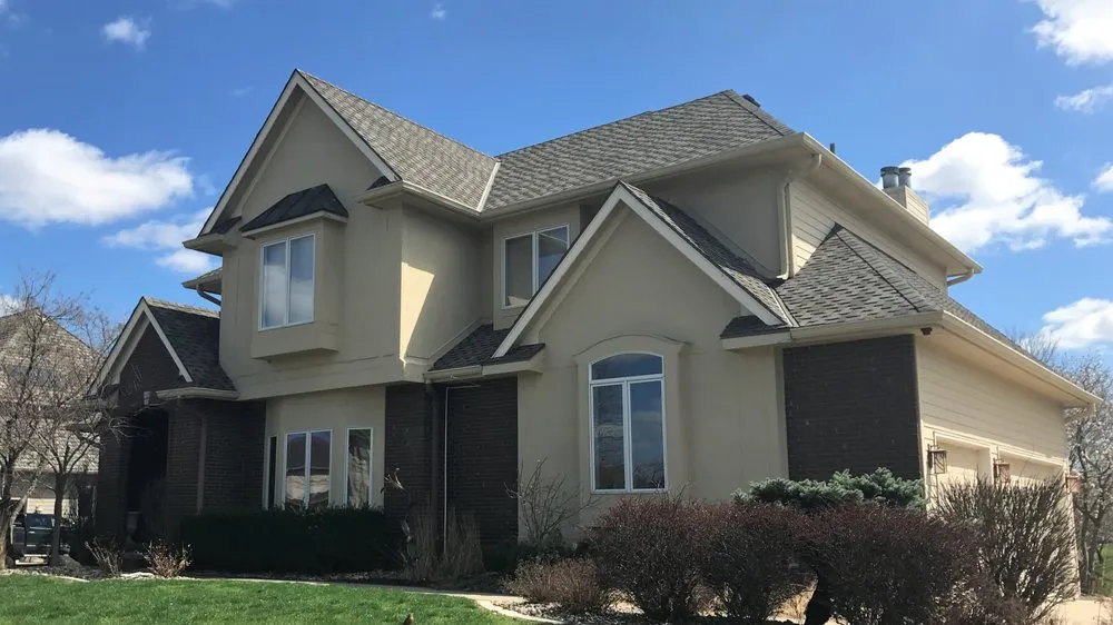 Local shingle roofing service for homes in Cumming, IA by Worth Exteriors