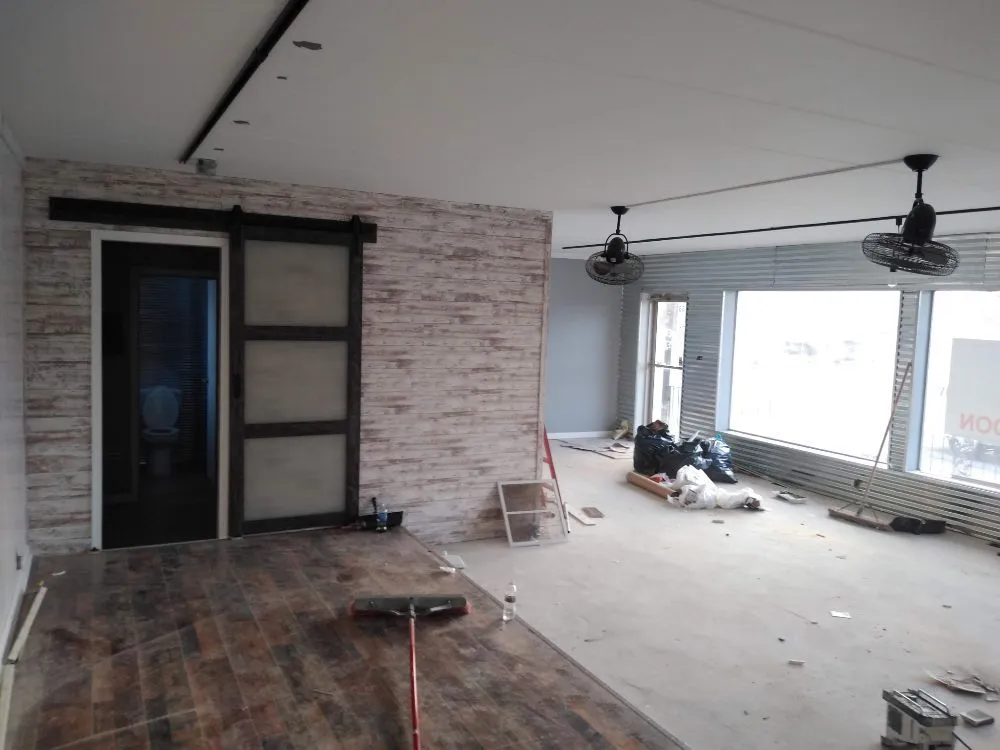 Slide of X Man Construction & Remodeling