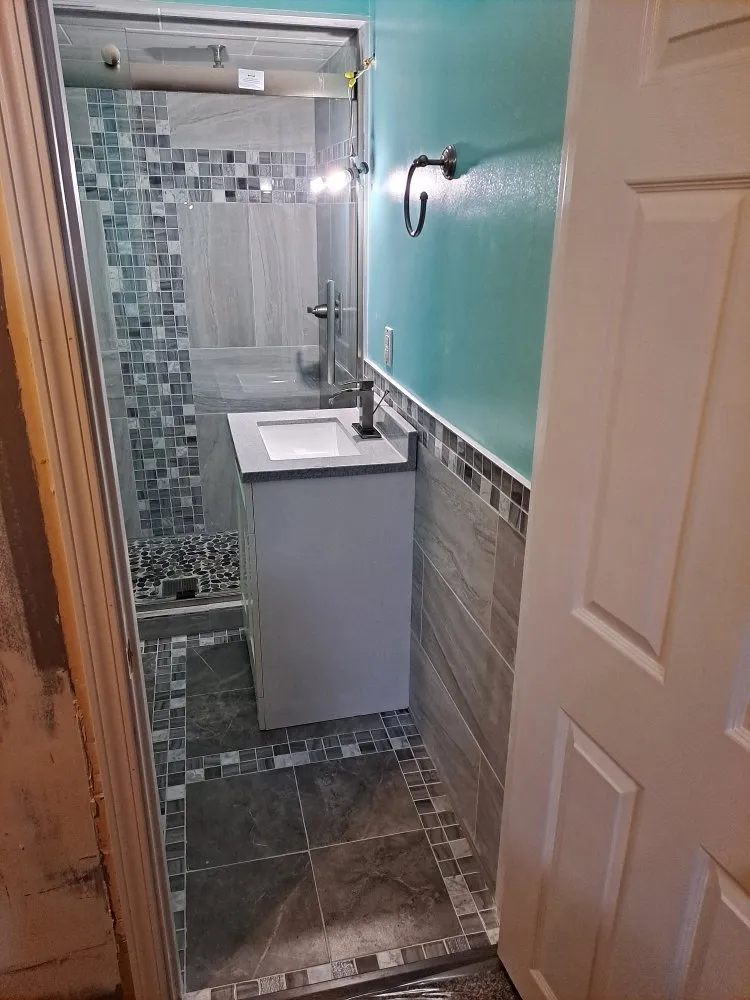 Slide of X Man Construction & Remodeling