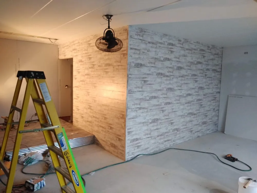 Slide of X Man Construction & Remodeling