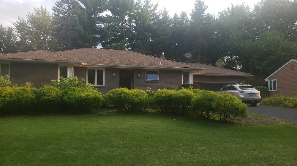 Local roof leak repair after storm damage in North St Paul, MN by Xpress Xteriors RSW
