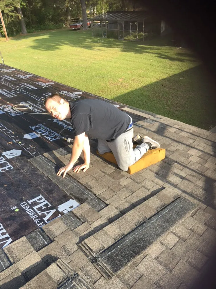 Slide of Yank's Roofing