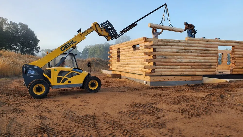 Slide of Yoder's Log & Timber Pro's