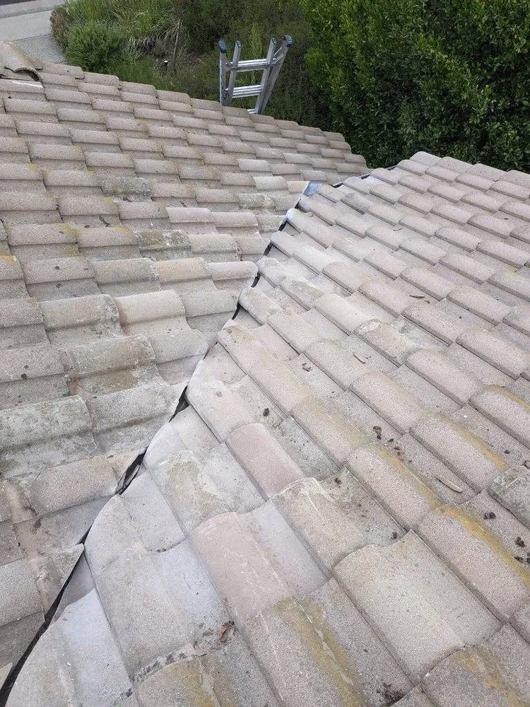 Slide of Zaguilan Roofing Service