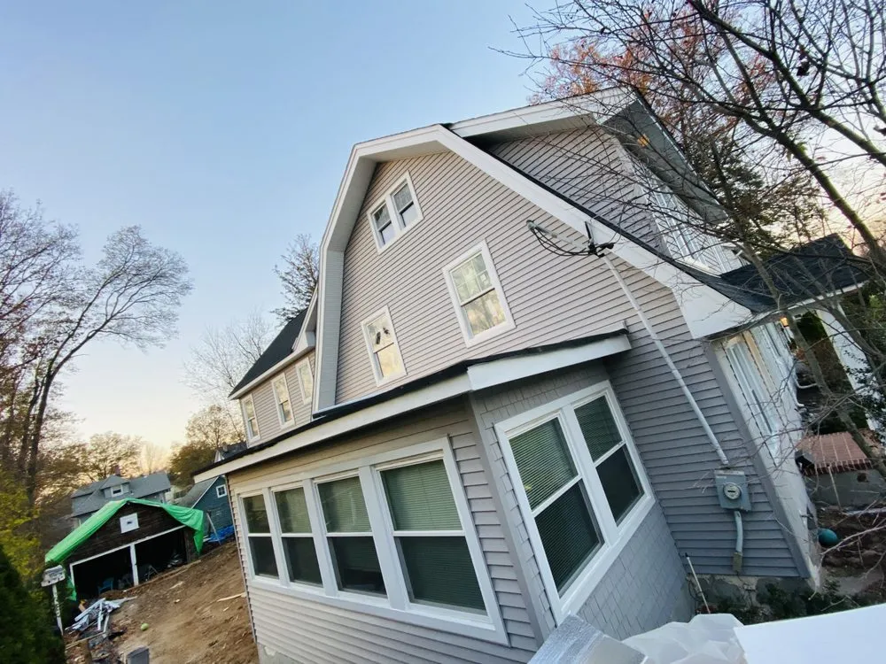 Slide of Zeus Siding & Windows