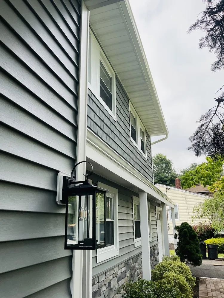 Slide of Zeus Siding & Windows