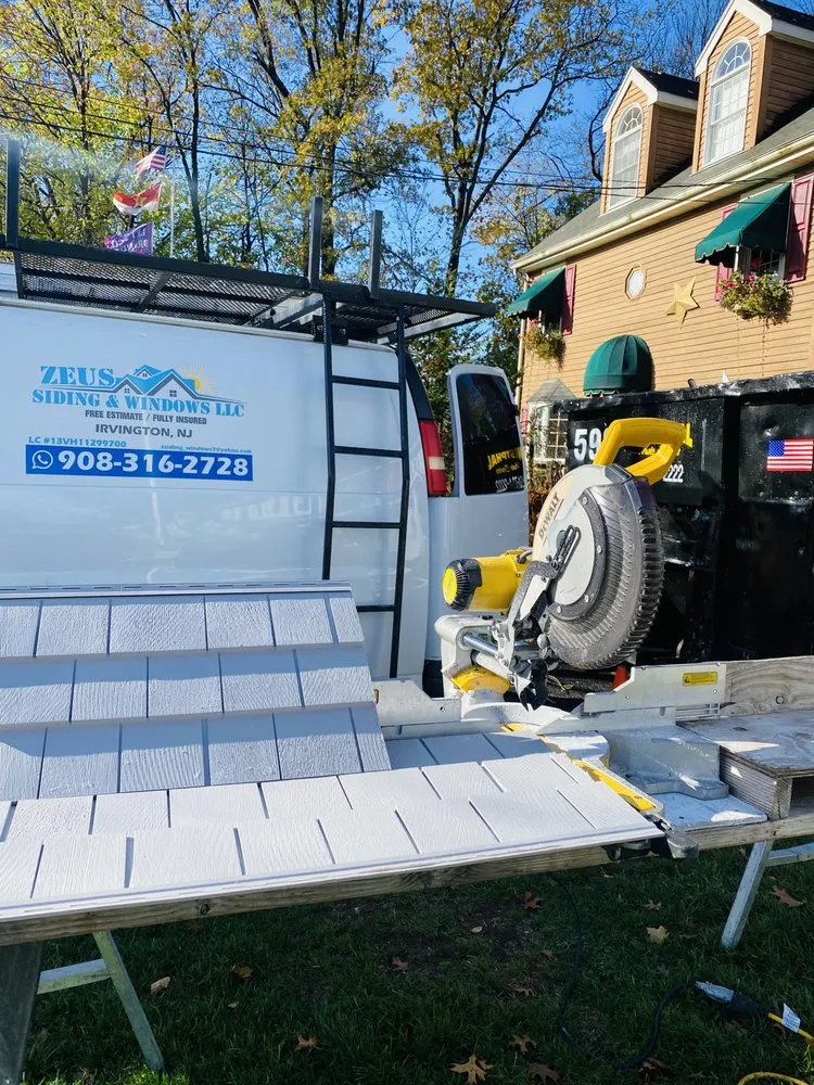 Slide of Zeus Siding & Windows