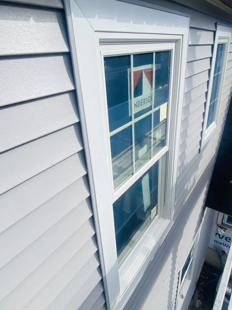 Slide of Zeus Siding & Windows