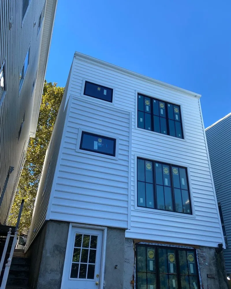 Slide of Zeus Siding & Windows