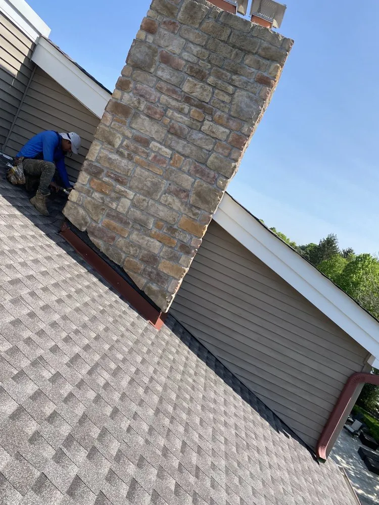 Slide of Zeus Siding & Windows