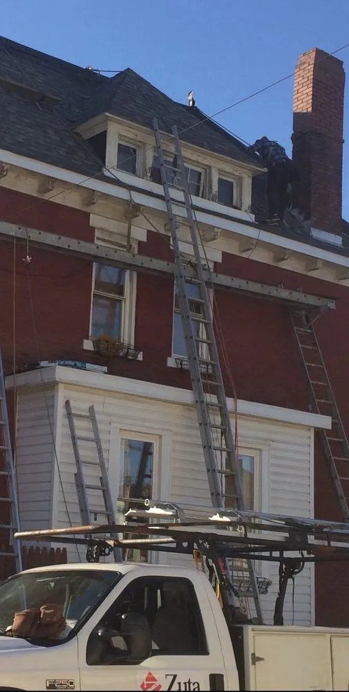 Slide of Zuta Roofing Specialists